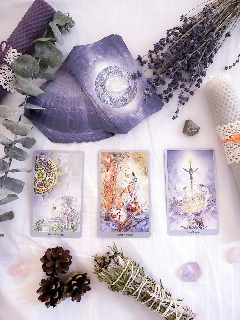Image of purple tarot cards on a table
